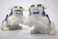 Lot 328 - Pair of Chinese blue and white lions of Fo