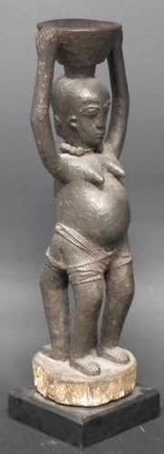 Lot 102 - Encrusted Janus male and female figure possibly Fon Bocio, 43cm high excluding base.