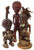 Lot 213 - Two Songye power figures and a Chokwe figure, the