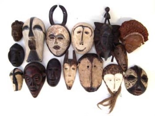 Lot 246 - Fifteen African masks carved in various tribal