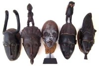 Lot 253 - Five Ivory Coast masks, the tallest measures 47cm
