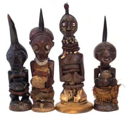 Lot 260 - Four Songye Nkisi power figures, the largest