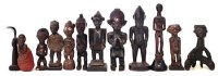 Lot 284 - Twelve small figures carved in various tribal