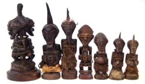 Lot 285 - Seven Songye Nkisi power figures, the largest