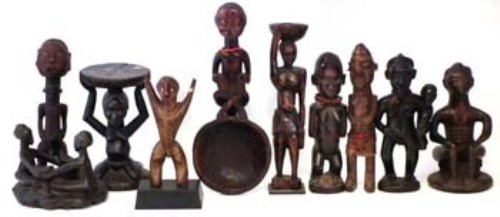 Lot 287 - Seven figure, a small stool, a spoon and figure