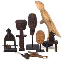 Lot 291 - Collection of items, to include a Dogon head, a small panel carved with an aligator, an Asante doll, Lobi slingshot, Ya