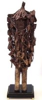 Lot 296 - Heavily encrusted figure, surrounded by a net or