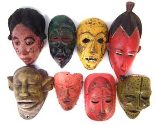 Lot 12 - Eight painted African masks carved in various