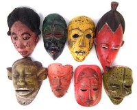 Lot 12 - Eight painted African masks carved in various