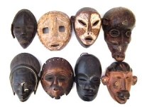 Lot 21 - Eight African masks carved in various tribal styles, the largest measures 31cm high