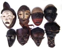 Lot 67 - Eight African masks carved in various