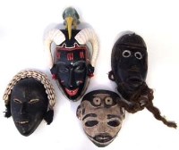 Lot 74 - Two Dan masks, a Guro - Yuare mask and one other
