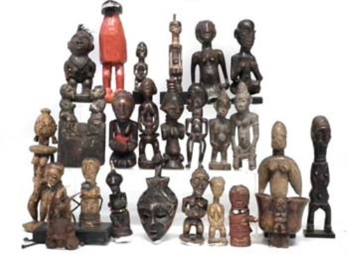Lot 78 - Twenty three small African figures carved in