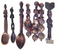 Lot 84 - Three spoons, a wand and three rattles, carved in