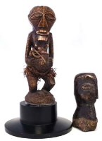 Lot 93 - Carved bone Songye Nkisi power figure, also one