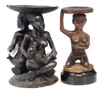 Lot 108 - Two Chief’s stools, carved with maternity figures, the largest measures 51cm high