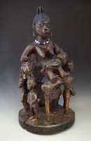 Lot 5 - Large Yoruba Epa female figure group, 80cm high