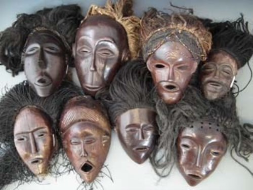Lot 22 - Eight masks carved in Chokwe and similar tribal