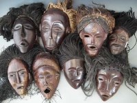 Lot 22 - Eight masks carved in Chokwe and similar tribal