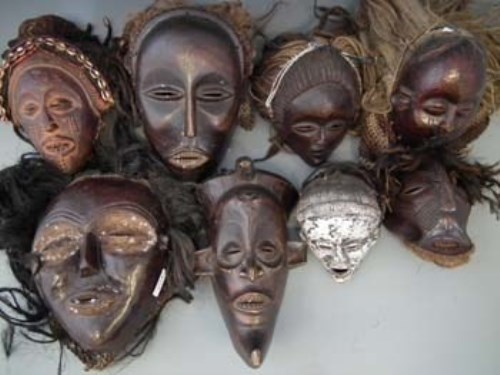 Lot 23 - Eight masks carved in Chokwe and similar tribal