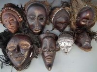Lot 23 - Eight masks carved in Chokwe and similar tribal