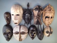 Lot 25 - Ten masks carved in various tribal styles, the