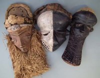 Lot 26 - Three Pende masks including a sickness mask, the