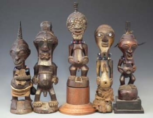 Lot 29 - Five Songye Nkisi figures, the tallest measures