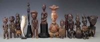 Lot 31 - Fourteen African figures carved in various tribal