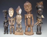 Lot 34 - Five figures, carved in Tabwa, Yaka, Lega, and
