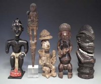 Lot 35 - Ngbaka mother and child figure, Yoruba seated figure, Sapi figure and two other African figures, the tallest measures 33cm high