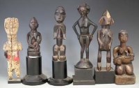 Lot 57 - Six African figures carved in various tribal