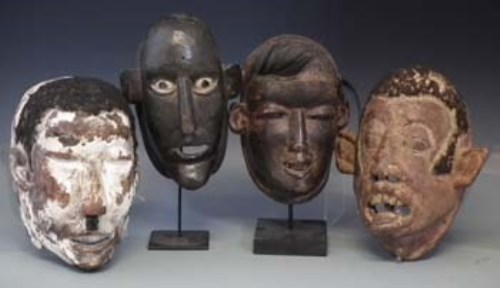 Lot 61 - Four Makonde type face masks, the tallest