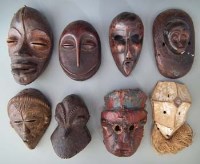 Lot 88 - Eight African masks, carved in various tribal