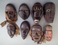 Lot 95 - Eight African masks carved in Dan, Bete and other