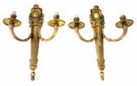 Lot 11 - A pair of late 19th century gilt brass twin branch wall lights