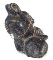 Lot 45 - Carved soapstone figure of an iiuit sitting on a