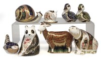 Lot 111 - Eight Royal Crown Derby paperweights, to include