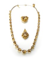 Lot 232 - Citrine yellow gold set graduating necklace with double-drop pendant.