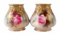 Lot 177 - Two Royal Worcester vases painted with roses.