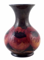 Lot 198 - Moorcroft small poppies vase.