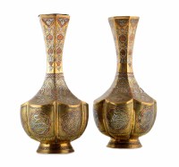 Lot 238 - A pair of brass Cairo ware vases inlaid with silver and copper.