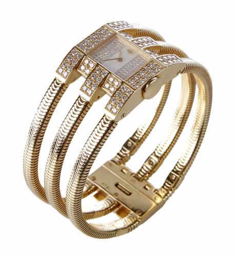 Lot 340 - An 18ct gold diamond wristwatch by Van Cleef & Arpels