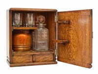 Lot 24 - A small 20th century oak art deco drinks cabinet