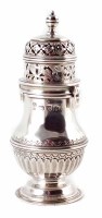 Lot 183 - Silver sugar shaker, round body with fluted decoration and reeded girdle, pierced-decoration to bayonet-fit lid, pedastal foot with inscriptio