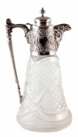Lot 190 - Early 20th century cut glass claret jug with embossed silver mounts and mask head lip, makers marks for Lee & Wigfull, Sheffield, 1905, 27.5cm high.