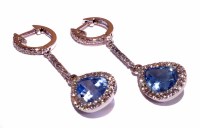 Lot 209 - blue stone and diamond set 18ct white gold drop earrings, the teardrop blue stones framed by 23 milgrain set brilliant cut diamonds, supended from dia