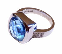 Lot 217 - 14ct white gold topaz and and diamond ring, cushion cut blue topaz in square bezel setting, diamond set shoulders, gross weight approx. 10.3g, ring si