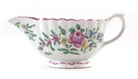 Lot 135 - Bow fluted sauce boat painted with polychrome flowers.