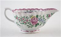 Lot 135 - Bow fluted sauce boat painted with polychrome flowers.